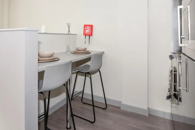 Table with chairs and fire blanket kitchen at Studio 58 in Bristol Student Accommodation