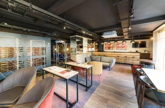 Modern communal area with sofas tables and mailboxes lounge at Ernest Place in Durham Student Accommodation