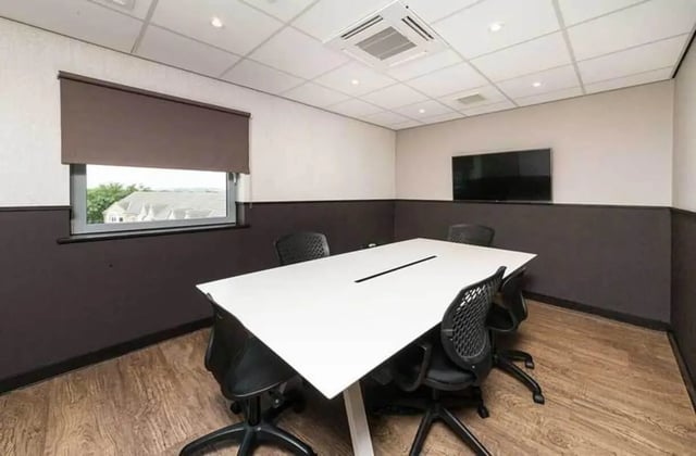 White table chairs and TV meeting room at Ernest Place in Durham Student Accommodation
