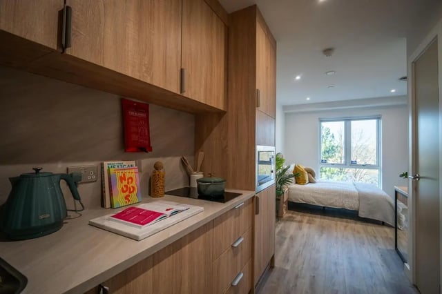 Kitchenette with kettle cookbooks and bed bedroom at The Sail Works in Lancaster Student Accommodation