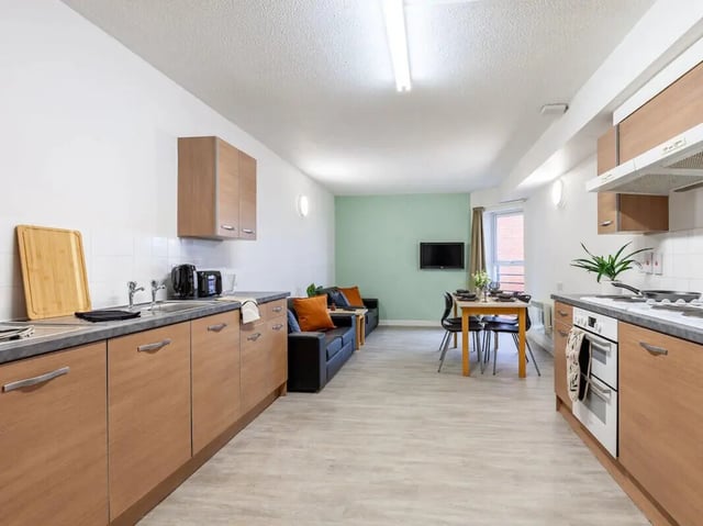 Kitchen living and dining area with sofa at Leighton Hall in Preston Student Accommodation