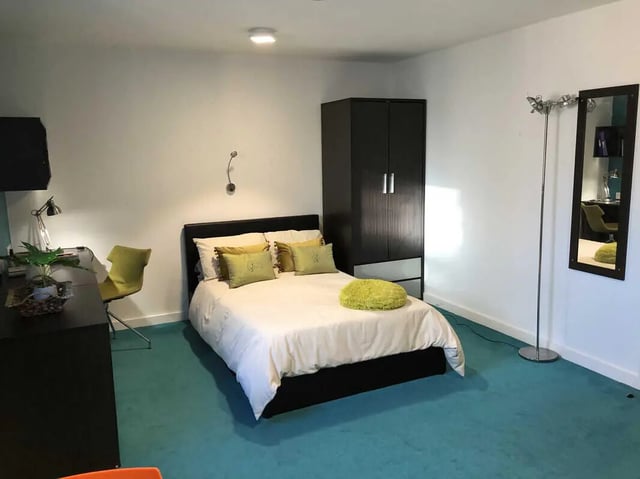 Bed wardrobe and desk bedroom at Plato House in Liverpool Student Accommodation