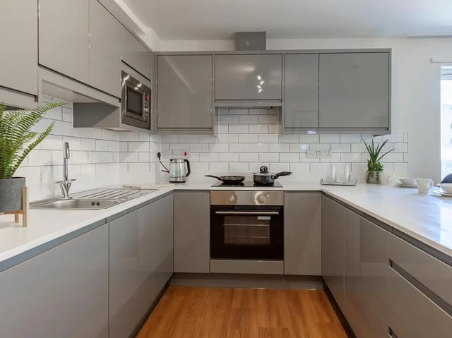 Modern grey kitchen with oven microwave sink kitchen at Trinity Student Village in Preston Student Accommodation