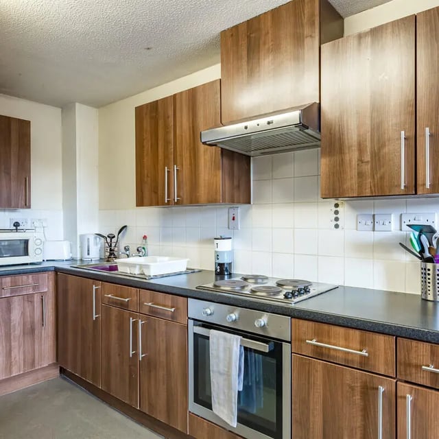 Kitchen cabinets countertop oven stovetop microwave sink kitchen at The Pinnacles in Sheffield Student Accommodation