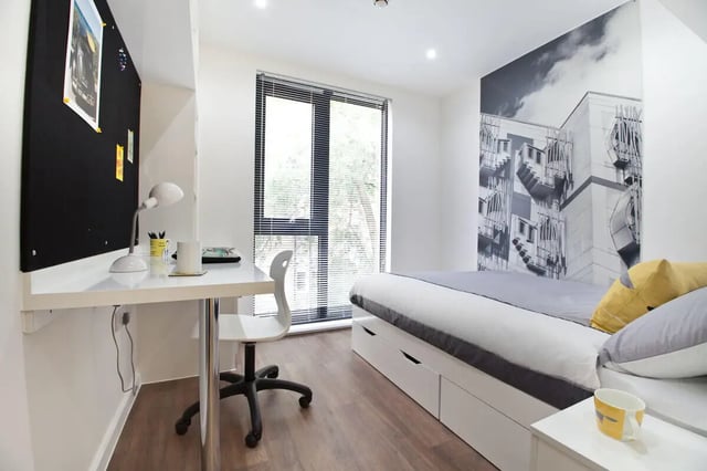 Desk chair bulletin board bed and window bedroom at Gateway Apartments in Edinburgh Student Accommodation