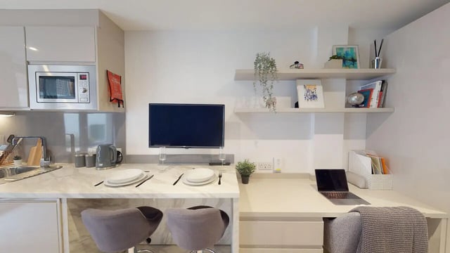 Kitchenette with TV and study area at 79 Silver Street in Reading Student Accommodation