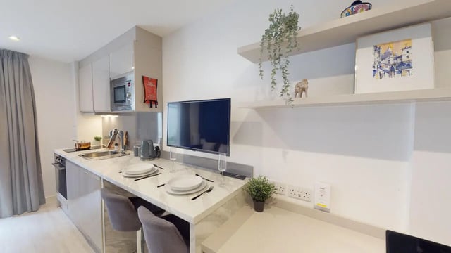 Modern kitchen with microwave sink plates television kitchen at 79 Silver Street in Reading Student Accommodation