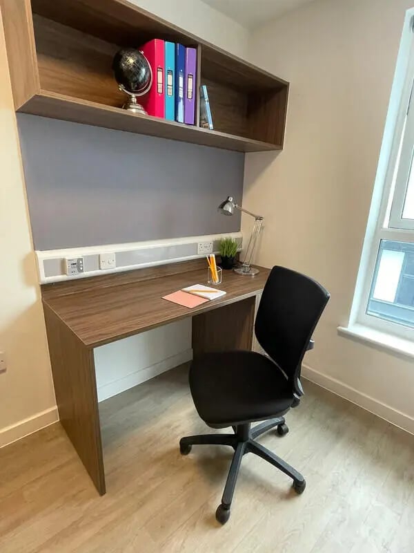 Desk with chair globe and binders study area at Phoenix Place in Liverpool Student Accommodation