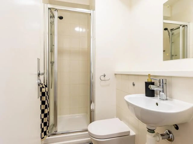 Shower toilet sink with towel bathroom at St Augustine's House in Plymouth Student Accommodation