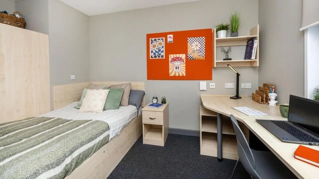 Bed desk and shelf student bedroom at The Forge in Sheffield Student Accommodation