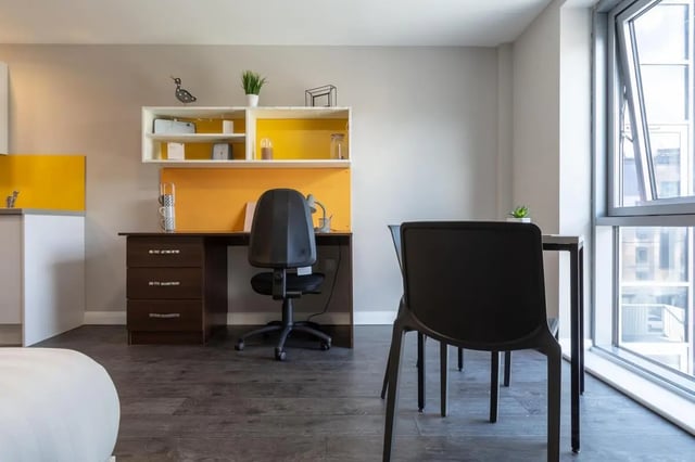 Desk with chair and shelving unit study area at One Islington Plaza in Liverpool Student Accommodation