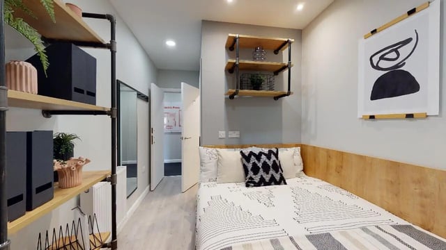 Bed with black white patterned duvet and pillows bedroom at Electric Press in Sheffield Student Accommodation