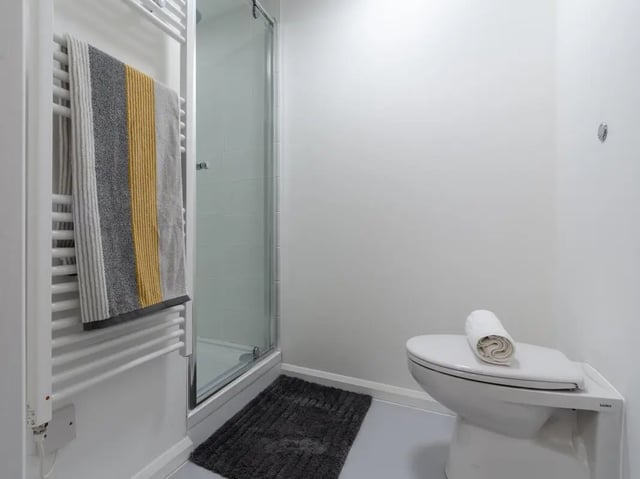 Towel rack toilet shower mat bathroom at One Islington Plaza in Liverpool Student Accommodation