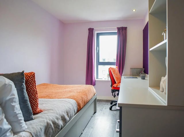 Bed desk chair and shelves bedroom at Beaverbank Place in Edinburgh Student Accommodation