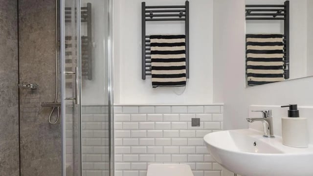 Shower sink towel radiator and mirror bathroom at Headrow Court in Leeds Student Accommodation
