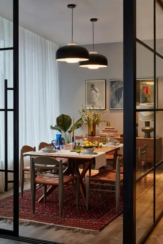 Dining table with chairs and placemats dining room at Tribu Kingston in Kingston Upon Thames Student Accommodation