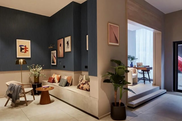 Modern seating area with art and desk visible living room at Tribu Kingston in Kingston Upon Thames Student Accommodation
