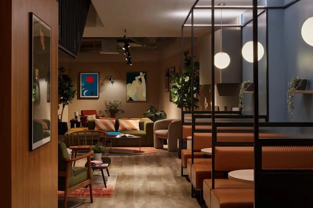 Sofa chairs and artwork in a common area at Tribu Kingston in Kingston Upon Thames Student Accommodation