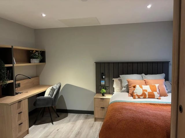 Bed desk chair and shelving unit bedroom at Arcadian in Nottingham Student Accommodation