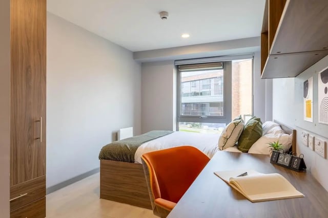 Bed desk chair pillows and wardrobe bedroom at Scotway House in Glasgow Student Accommodation