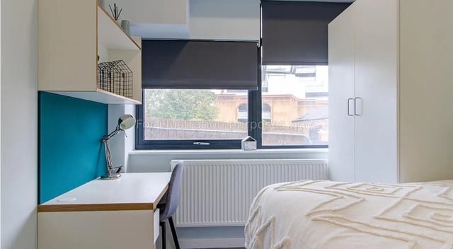 Desk chair lamp and wardrobe bedroom at Urban Student Village in Coventry Student Accommodation