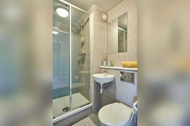 Glass shower sink toilet mirror towel bathroom at Selly Oak Court in Birmingham Student Accommodation