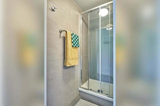 Glass shower enclosure with towels hanging Bathroom at Selly Oak Court in Birmingham Student Accommodation