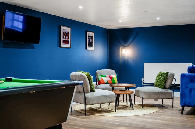 Pool table chairs and tables living room at AXO Waterloo in London Student Accommodation