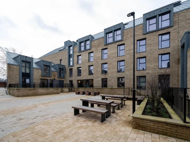 Courtyard with picnic tables and buildings exterior at The Gorge in Exeter Student Accommodation