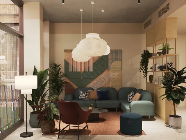 Sectional sofa coffee table plants living room at Venti House in London Student Accommodation