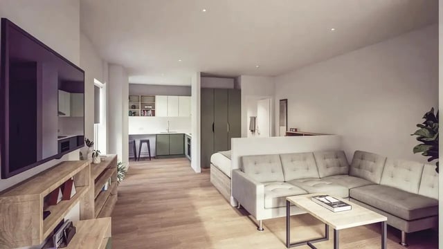 Sofa coffee table and kitchen living room at St Chads Student Village in Birmingham Student Accommodation