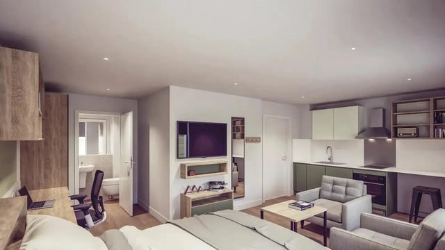 Bed desk chairs kitchen sofa and TV studio at St Chads Student Village in Birmingham Student Accommodation