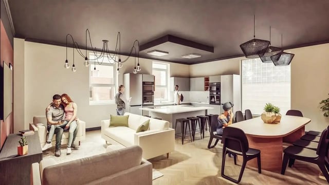 Couples sofas kitchen island bar stools dining table living area at St Chads Student Village in Birmingham Student Accommodation