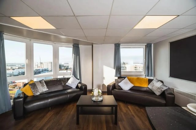 Two brown sofas coffee table and windows living room at The Junxion Lincoln in Lincoln Student Accommodation
