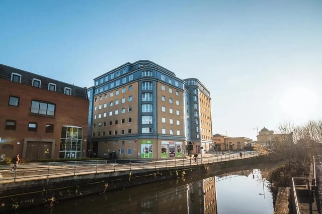 Student accommodation building exterior with canal reflection exterior at The Junxion Lincoln in Lincoln Student Accommodation