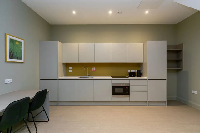 Kitchen with cabinets sink microwave toaster kettle kitchen at Beechenhurst House in Birmingham Student Accommodation