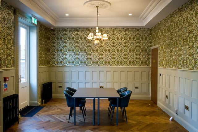 Table and chairs in patterned room living area at Beechenhurst House in Birmingham Student Accommodation