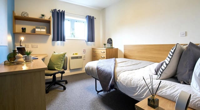 Desk bed dresser window radiator bedroom at Barker House in Newcastle Upon Tyne Student Accommodation