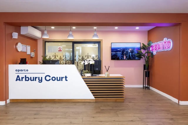 Reception desk with apartment name and TV reception area at Aparto Arbury Court in Kingston Upon Thames Student Accommodation