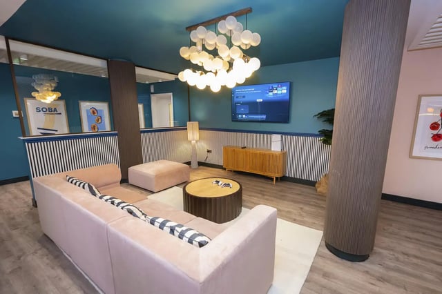 Pink sofa ottoman coffee table TV lounge at Aparto Arbury Court in Kingston Upon Thames Student Accommodation