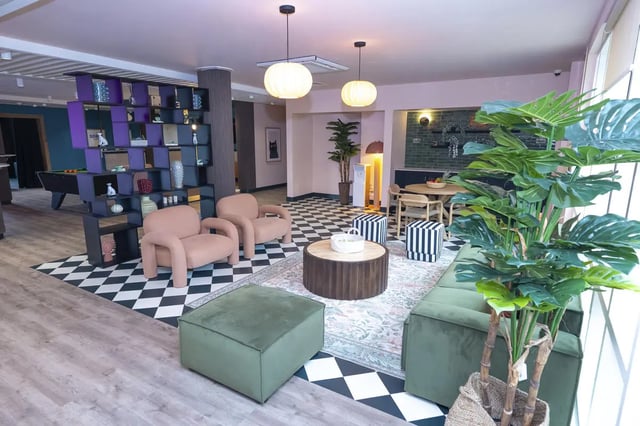 Chairs sofa shelving and pool table common area at Aparto Arbury Court in Kingston Upon Thames Student Accommodation
