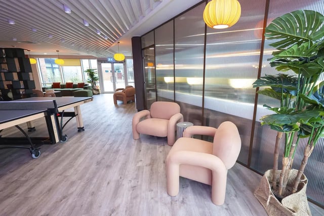 Ping pong table two pink chairs communal area at Aparto Arbury Court in Kingston Upon Thames Student Accommodation