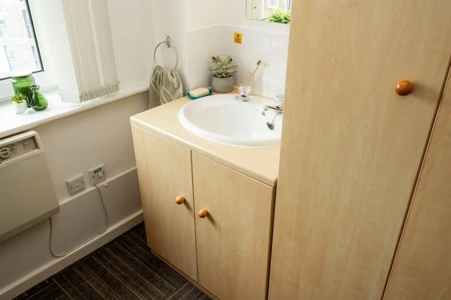Sink cabinet with wooden doors and towel ring Bathroom at Marybone Student Village 1 in Liverpool Student Accommodation