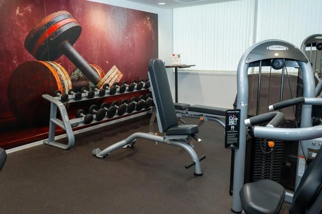 Dumbbells weight bench and exercise machine gym at Marybone Student Village 1 in Liverpool Student Accommodation