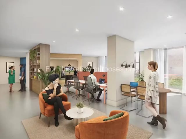 Office area with desks chairs and people living area at The Quarter House in Bristol Student Accommodation