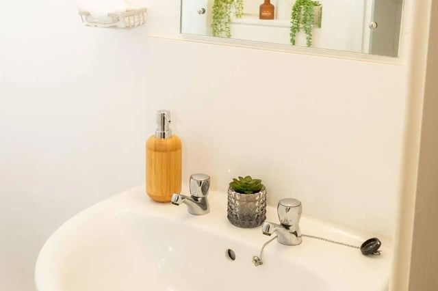 Sink with soap dispenser and plant Bathroom at Marybone Student Village 2 in Liverpool Student Accommodation