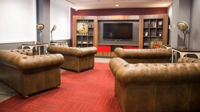 Leather sofas and entertainment unit living room at Marybone Student Village 2 in Liverpool Student Accommodation