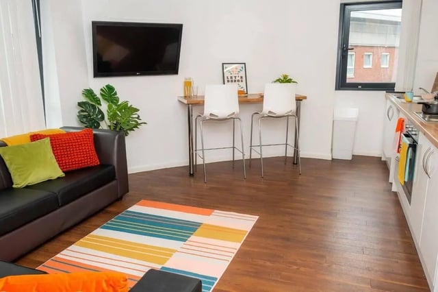 Sofa bar table chairs TV kitchen area living room at Marybone Student Village 2 in Liverpool Student Accommodation