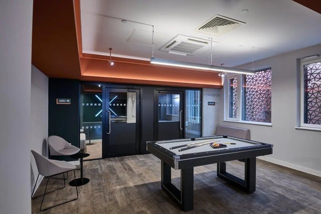 Pool table chairs and games room doors playing area at Sheares Hall in Newcastle Upon Tyne Student Accommodation