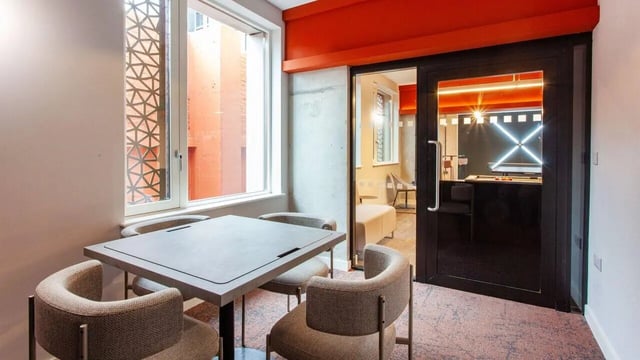 Table and chairs near game room interior at Sheares Hall in Newcastle Upon Tyne Student Accommodation